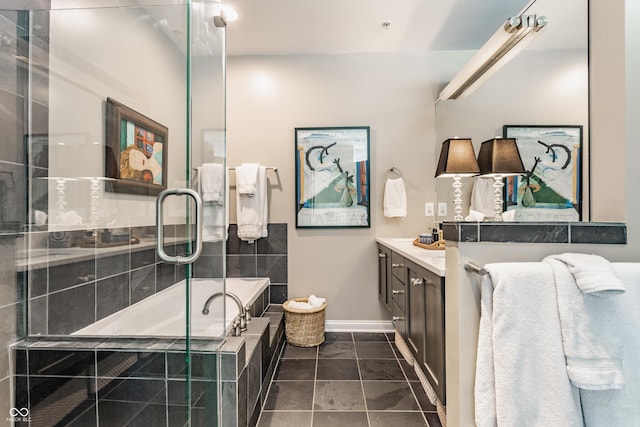 full bath with vanity, baseboards, a stall shower, tile patterned floors, and a bath