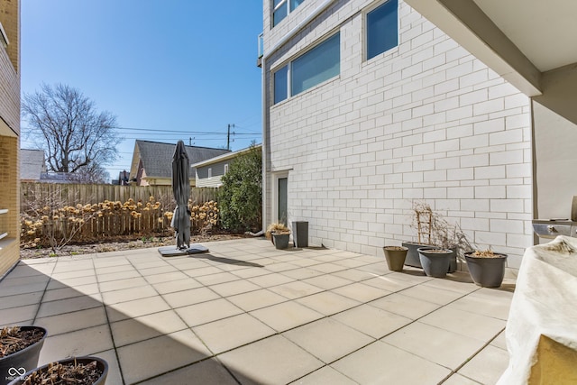 view of patio / terrace featuring fence