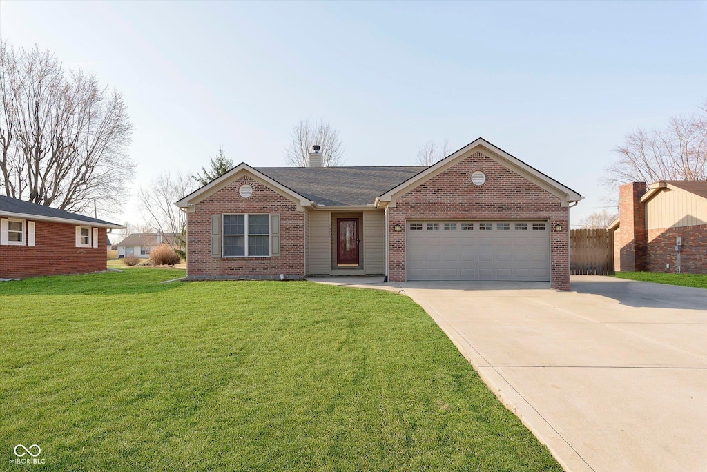 ranch-style home featuring a chimney, concrete driveway, a front lawn, a garage, and brick siding