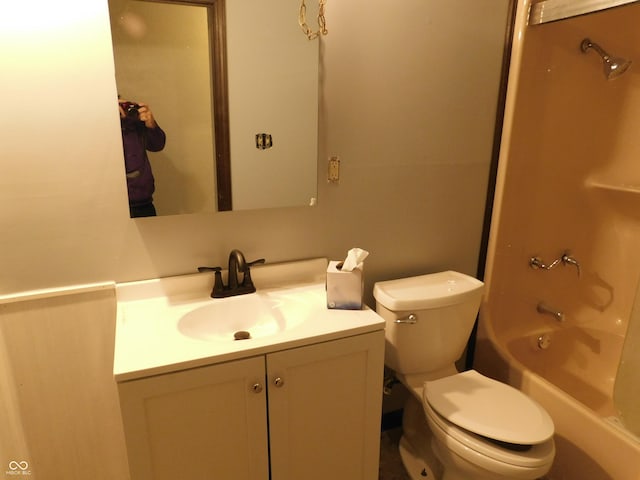 bathroom with shower / tub combination, vanity, and toilet