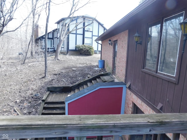 view of side of property with brick siding