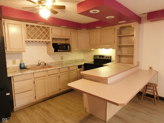 kitchen featuring stainless steel electric range oven, open shelves, light countertops, a sink, and a kitchen breakfast bar