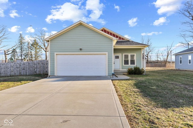 view of front facade featuring an attached garage, driveway, a front yard, and fence