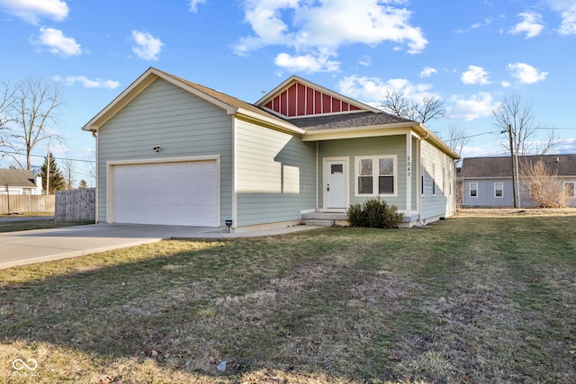 view of front of house featuring a garage, driveway, fence, a front lawn, and board and batten siding