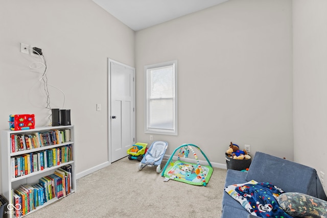 game room with carpet and baseboards