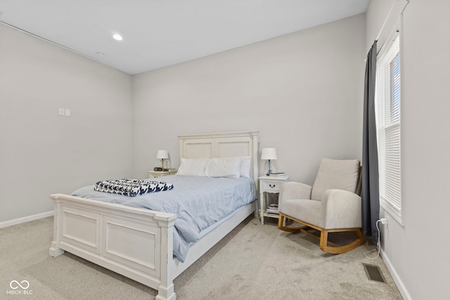 bedroom featuring light carpet, recessed lighting, visible vents, and baseboards