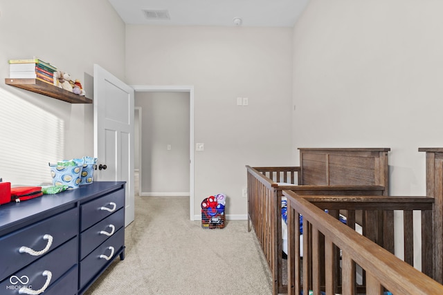 bedroom with light carpet, baseboards, and visible vents