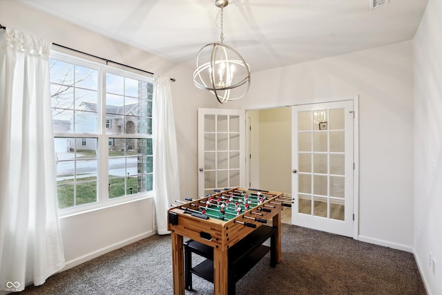 rec room with an inviting chandelier, baseboards, carpet flooring, and french doors