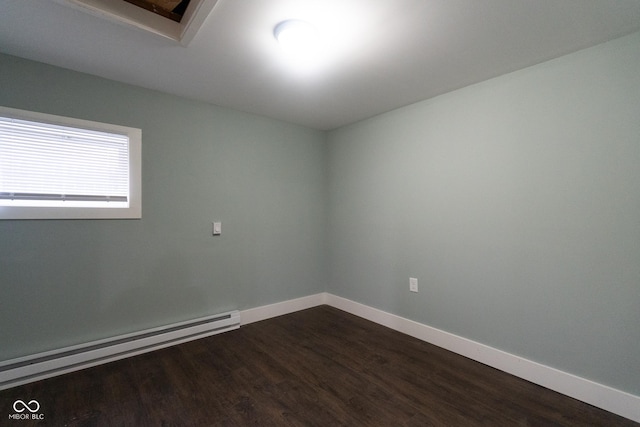 238-240 N Beville Ave, Indianapolis, IN 46201 - empty room with baseboards, baseboard heating, and dark wood-type flooring