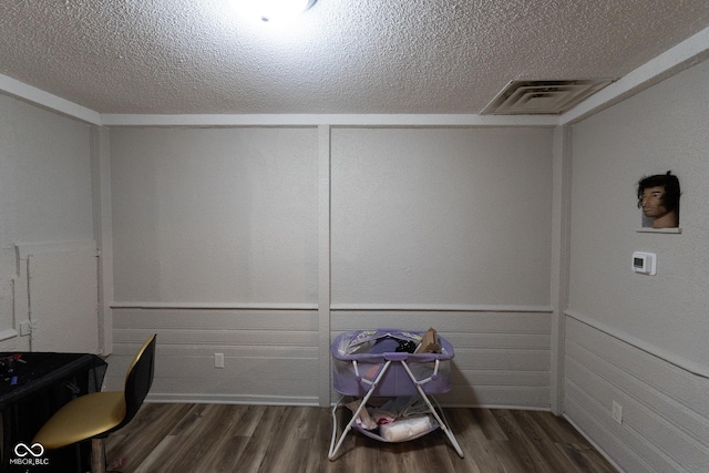 238-240 N Beville Ave, Indianapolis, IN 46201 - unfurnished office featuring wainscoting, visible vents, a textured ceiling, and wood finished floors