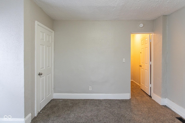 238-240 N Beville Ave, Indianapolis, IN 46201 - unfurnished room with a textured ceiling, carpet floors, visible vents, and baseboards