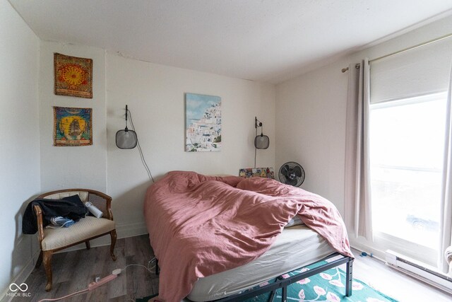 238-240 N Beville Ave, Indianapolis, IN 46201 - bedroom with a baseboard radiator and multiple windows