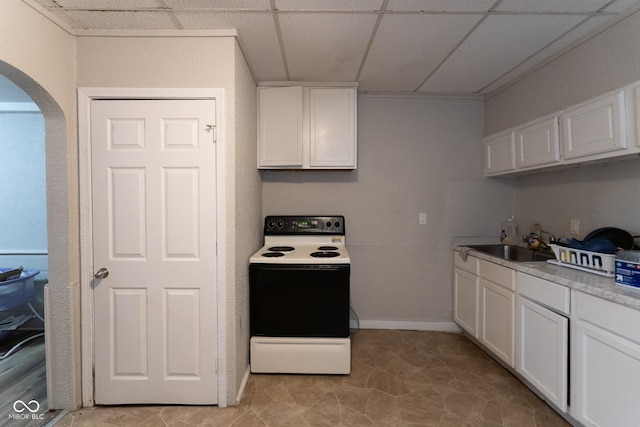 238-240 N Beville Ave, Indianapolis, IN 46201 - kitchen with arched walkways, white cabinets, white electric range, and a sink
