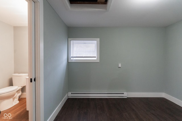 238-240 N Beville Ave, Indianapolis, IN 46201 - empty room featuring a baseboard radiator, wood finished floors, and baseboards