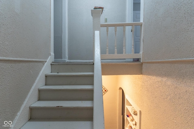 238-240 N Beville Ave, Indianapolis, IN 46201 - stairway featuring a textured wall