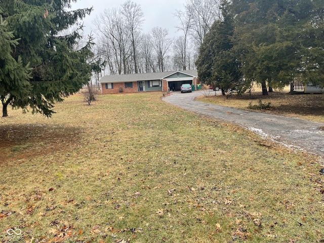 single story home featuring driveway and a front yard