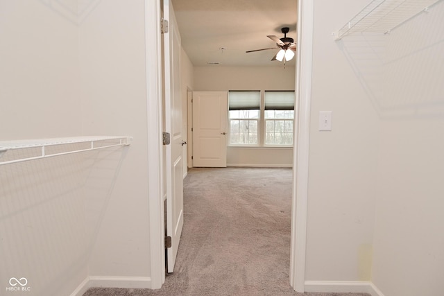 hall with carpet and baseboards