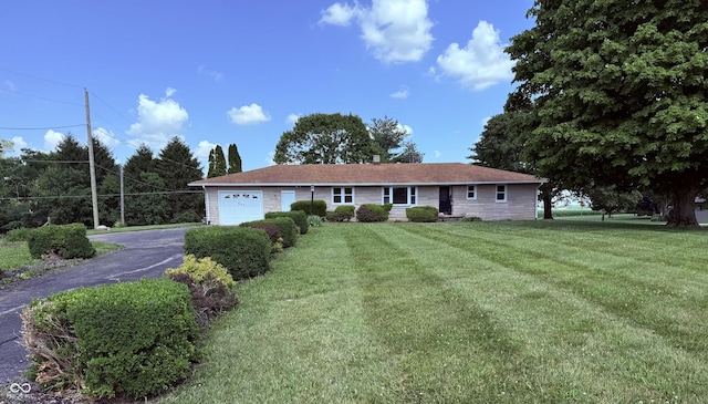 662 S County Road 150 W, Greensburg, IN 47240 - single story home with an attached garage, asphalt driveway, and a front yard