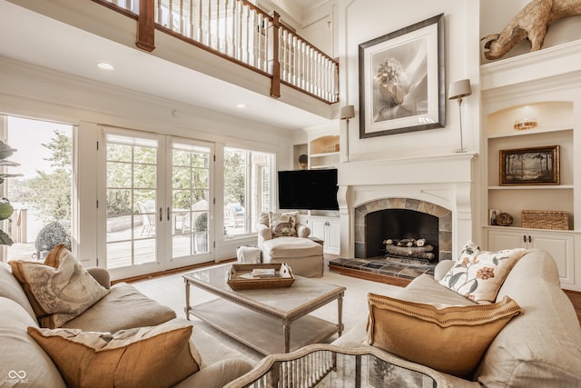 6560 Dawson Lake Dr, Indianapolis, IN 46220 - living room with french doors, carpet flooring, a high ceiling, a tiled fireplace, and ornamental molding