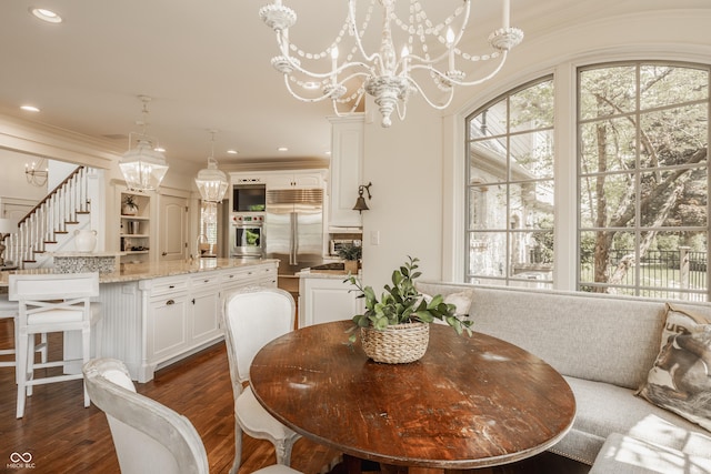 6560 Dawson Lake Dr, Indianapolis, IN 46220 - dining area with a chandelier, dark wood-type flooring, stairs, ornamental molding, and recessed lighting