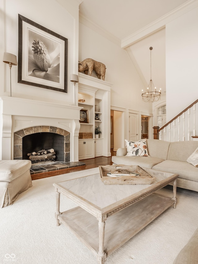 6560 Dawson Lake Dr, Indianapolis, IN 46220 - living room with a chandelier, high vaulted ceiling, a tiled fireplace, carpet, and ornamental molding