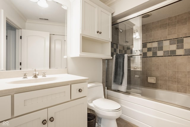 6560 Dawson Lake Dr, Indianapolis, IN 46220 - bathroom with ornamental molding, toilet, enclosed tub / shower combo, vanity, and tile patterned flooring