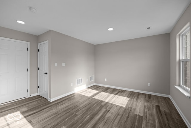 spare room featuring visible vents and a wealth of natural light