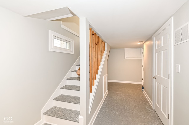 staircase featuring visible vents and baseboards