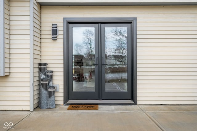 view of exterior entry featuring french doors