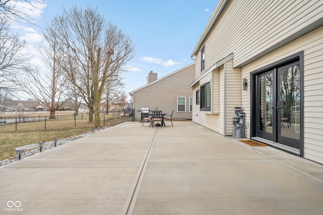 view of patio / terrace with outdoor dining space and fence