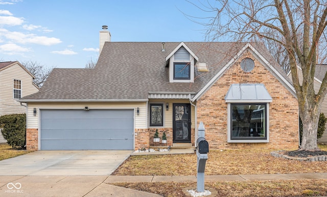 view of front facade with a garage, a chimney, concrete driveway, and brick siding