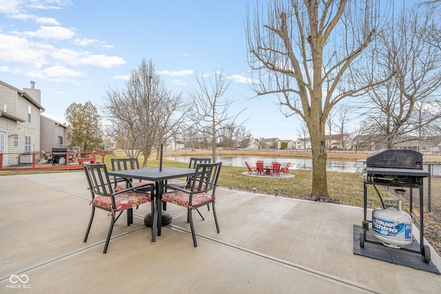 view of patio / terrace featuring outdoor dining space and a water view