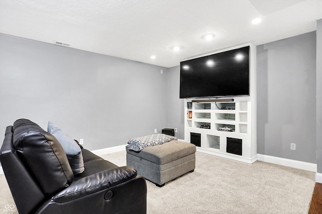 living area featuring baseboards, visible vents, carpet flooring, and recessed lighting