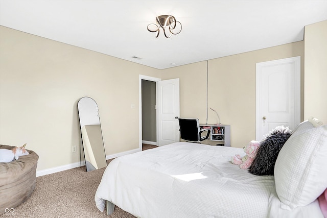 carpeted bedroom featuring baseboards