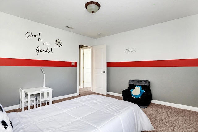 carpeted bedroom featuring baseboards and visible vents