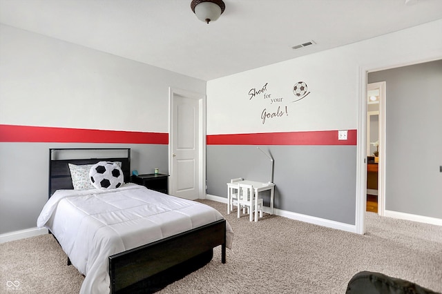 carpeted bedroom with visible vents and baseboards