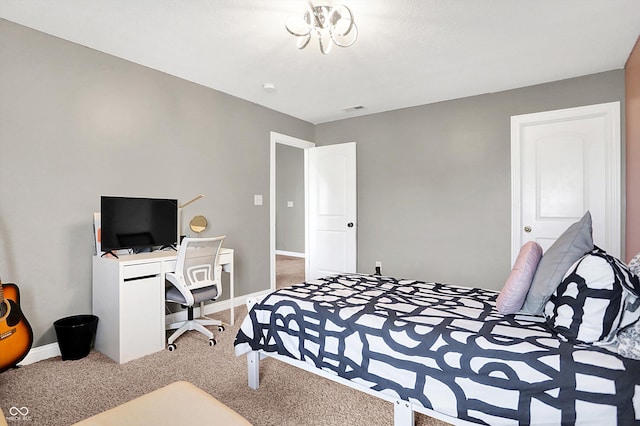 bedroom featuring baseboards and carpet flooring