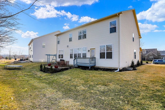 rear view of property with a lawn