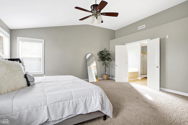 bedroom featuring lofted ceiling, multiple windows, visible vents, and carpet flooring