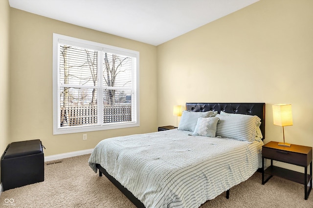 bedroom with baseboards, visible vents, and carpet flooring