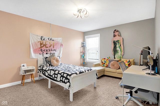 bedroom featuring light colored carpet and baseboards