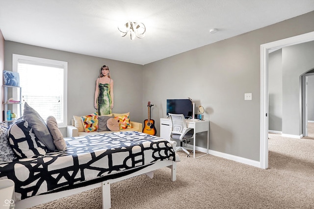 carpeted bedroom with baseboards