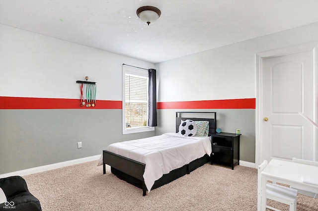 bedroom with carpet and baseboards