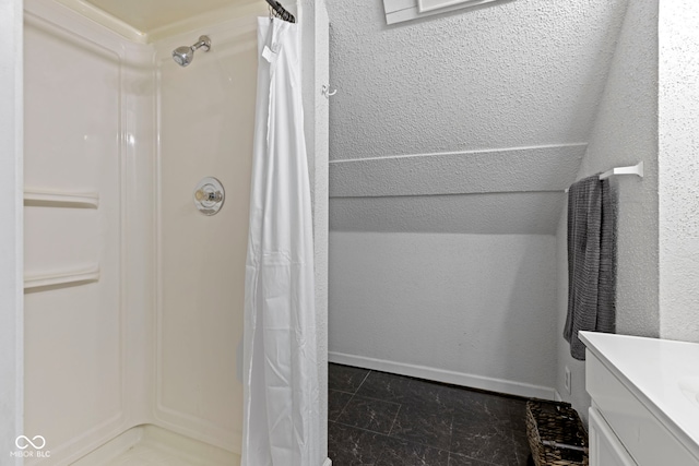 full bath with a shower with curtain, vanity, and baseboards