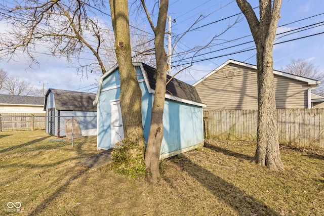 view of shed with a fenced backyard