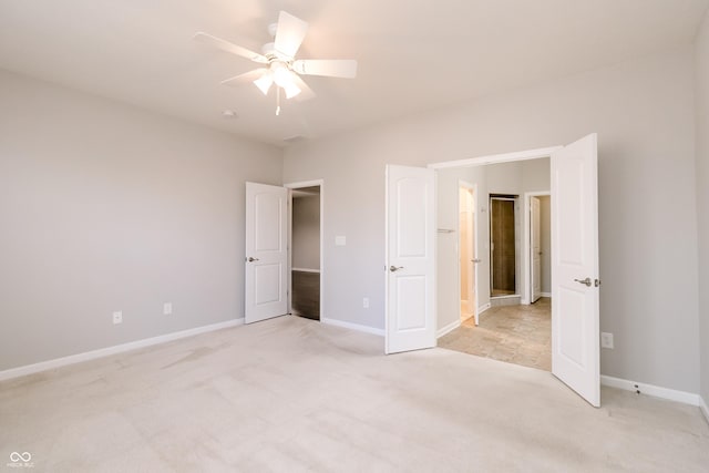 6117 Arctic Cir, Indianapolis, IN 46237 - unfurnished bedroom with light colored carpet, baseboards, and ceiling fan
