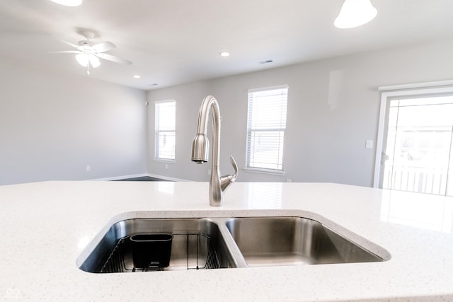 6117 Arctic Cir, Indianapolis, IN 46237 - kitchen featuring a sink, recessed lighting, ceiling fan, and light stone counters