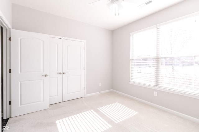 6117 Arctic Cir, Indianapolis, IN 46237 - unfurnished bedroom featuring light colored carpet, a closet, baseboards, and ceiling fan