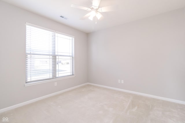 6117 Arctic Cir, Indianapolis, IN 46237 - spare room featuring light carpet, baseboards, and plenty of natural light