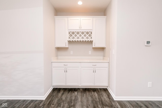 6117 Arctic Cir, Indianapolis, IN 46237 - indoor dry bar featuring dark wood-type flooring and baseboards